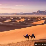 몽골의 주요 사진 명소 - A breathtaking sunrise scene over the Gobi Desert&rsquo;s towering sand dunes, where warm golden light cas...